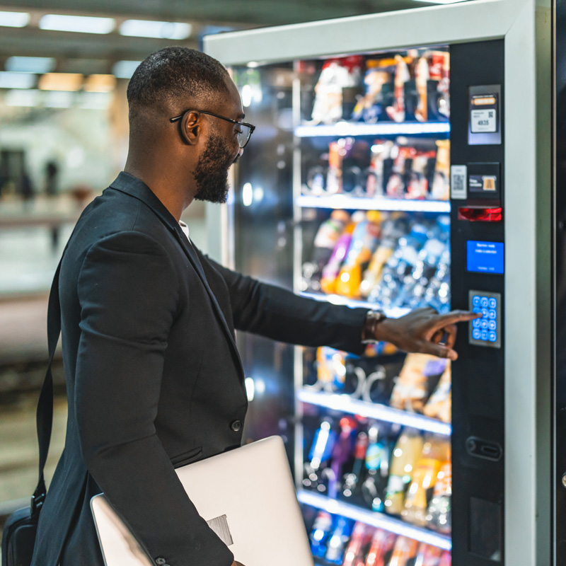 man ordering out of a vending machine